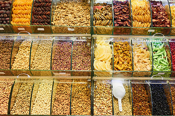 Image showing Market stall with various dried fruits and nuts