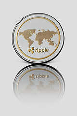 Image showing Coin ripple on white glossy background. Business concept