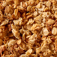 Image showing Close-up of homemade natural Oat Granola breakfast cereal as background. Textura of oat flakes.