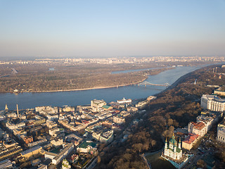 Image showing Kiev, Ukraine - April 7, 2018: Panoramic view of the Dnieper River pedestrian bridge, Trukhanov Island and Andreevskaya church .