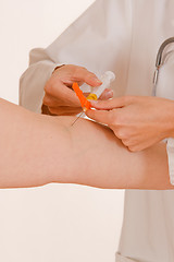 Image showing Doctor and the syringe