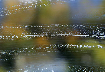 Image showing Bright color texture with soap foam pattern on glass