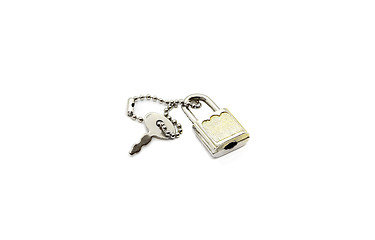 Image showing Small metallic padlock and key for bag or suitcase