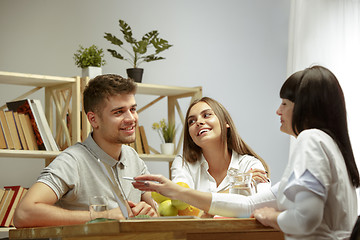 Image showing Smiling nutritionist showing a healthy diet plan to patient