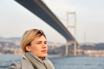 Image showing Portrait of a young woman under the Bosporus bridge.