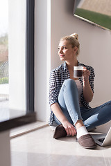 Image showing young woman drinking coffee enjoying relaxing lifestyle