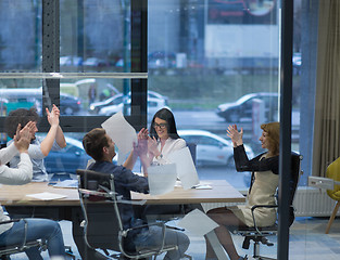 Image showing startup Group of young business people throwing documents