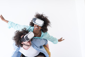 Image showing multiethnic couple getting experience using VR headset glasses