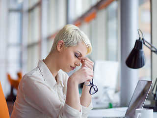 Image showing businesswoman using a laptop in startup office