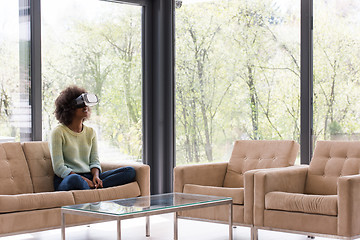 Image showing black woman using VR headset glasses of virtual reality