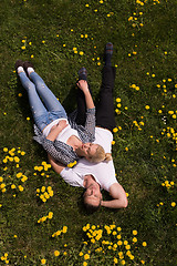 Image showing man and woman lying on the grass