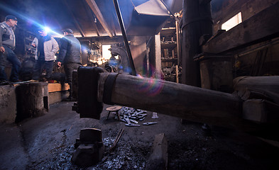 Image showing old mechanical hammer at blacksmith traditional workshop