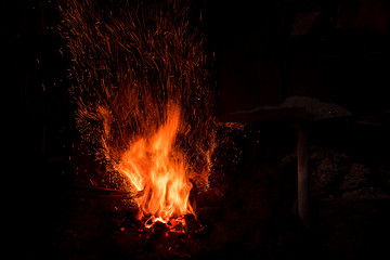 Image showing Traditional blacksmith furnace with burning fire