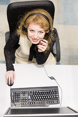 Image showing female call centre operator doing her job top view