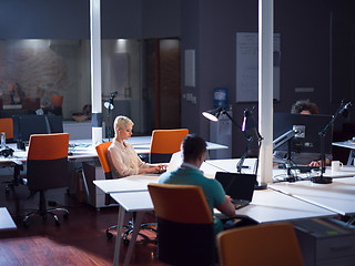 Image showing designers in the night startup office