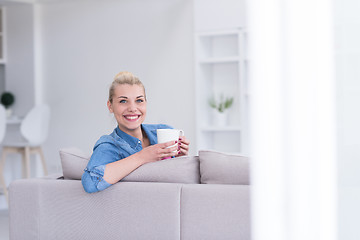Image showing woman enjoying a cup of coffee