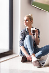 Image showing young woman drinking coffee enjoying relaxing lifestyle