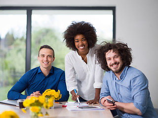 Image showing Multiethnic startup Business Team At A Meeting at modern office 