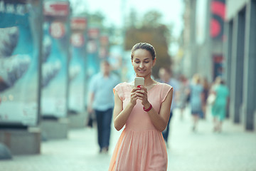 Image showing Young Beautiful Woman Talking On Mobile Phone Outdoor.