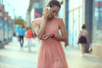 Image showing Young Beautiful Woman Talking On Mobile Phone Outdoor.