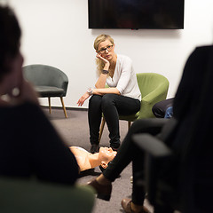 Image showing Instructor teaching first aid cardiopulmonary resuscitation course and use of automated external defibrillator on CPR workshop.