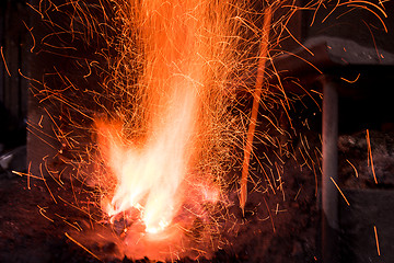 Image showing Traditional blacksmith furnace with burning fire