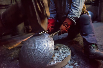 Image showing blacksmith workers using mechanical hammer at workshop