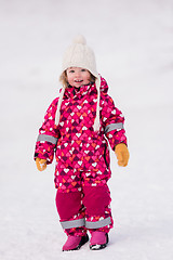 Image showing little girl having fun at snowy winter day