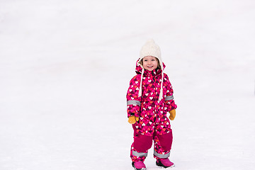 Image showing little girl having fun at snowy winter day