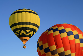 Image showing Yellow and red hot air balloons