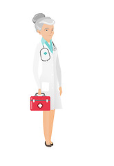 Image showing Senior caucasian doctor holding first aid box.