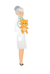 Image showing Senior caucasian pediatrician holding teddy bear.