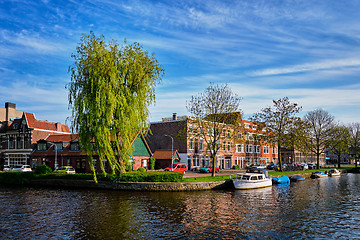 Image showing Boats, houses and canal. Harlem, Netherlands