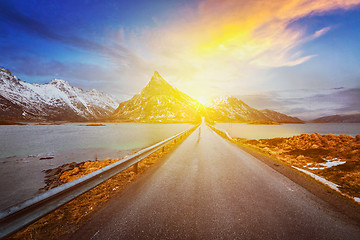 Image showing Road in Norway in fjord on sunset