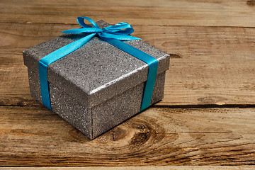 Image showing Gift box with blue ribbon