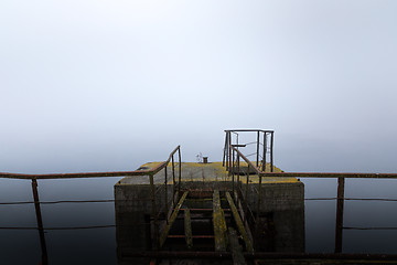 Image showing Damaged pier in the mist at morning