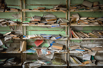 Image showing Abandoned bookstore with shelves full of worn books