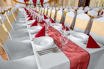 Image showing Large dining hall with tables set up