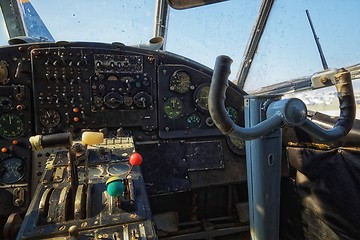 Image showing Center console and throttles in an old airplane