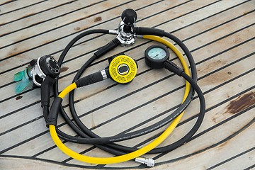 Image showing Diving regulators and mouthpiece on boat deck