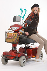 Image showing Disabled elderly woman with scooter