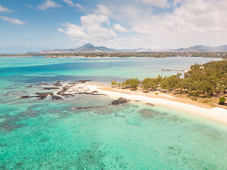 Image showing Aerial view of beautiful tropical beach with turquoise sea. Tropical vacation paradise destination of D\'eau Douce and Ile aux Cerfs Mauritius