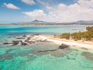 Image showing Aerial view of beautiful tropical beach with turquoise sea. Tropical vacation paradise destination of D\'eau Douce and Ile aux Cerfs Mauritius