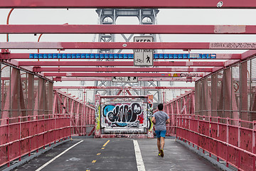 Image showing Unrecognizable sporty recreational male runner funning at Williamsburg bridgein New York City, USA