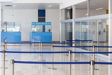 Image showing Blue passport control cabines at the empty airport terminal