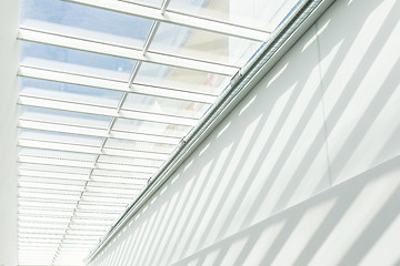 Image showing Geometric shapes and patterns in contemporary architecture. Shadow on the white wall.