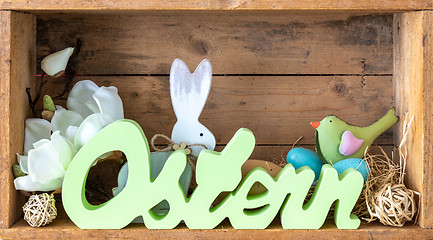 Image showing word easter in german language with decoration in a wooden box