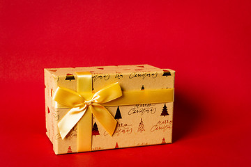 Image showing Christmas gift box on red background