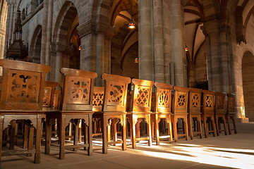 Image showing a row of wooden chairs in an old church