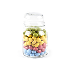 Image showing Colorful sweet candies in glass jar isolated on white.